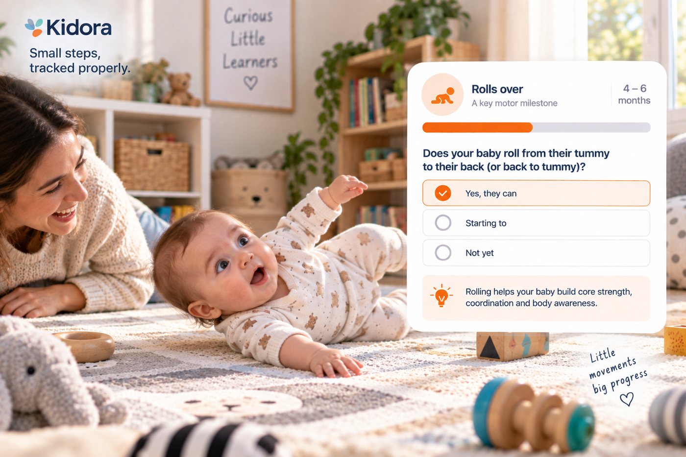 A baby lies on a play mat mid-roll from tummy to back, looking up at her mother who lies on the floor beside her. A Kidora card shows the rolls over milestone at 4 to 6 months.